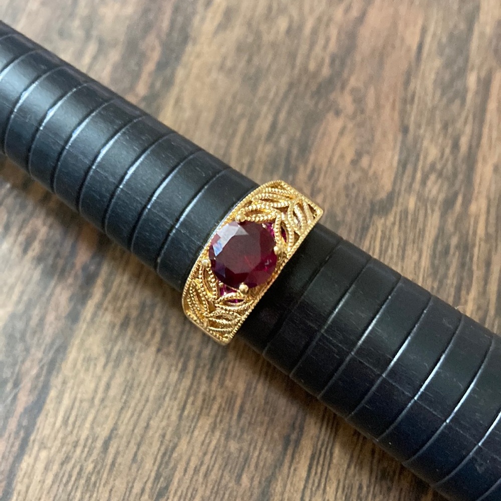 Sterling silver ring with plating and red stone